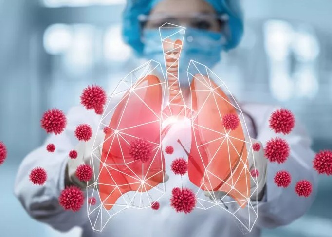 hình ảnh minh họa của một số lá phổi được bao phủ bởi các mô tả của vi rút SARS-CoV-2. Các nhà nghiên cứu đã gợi ý rằng vắc-xin dạng hít có thể vượt trội hơn loại được tiêm.